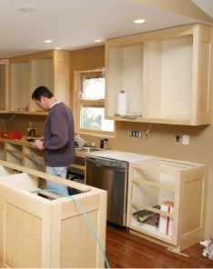 Newly framed kitchen island and wall cabinets during renovation in Thousand Oaks, highlighting custom cabinetry and modern layout.